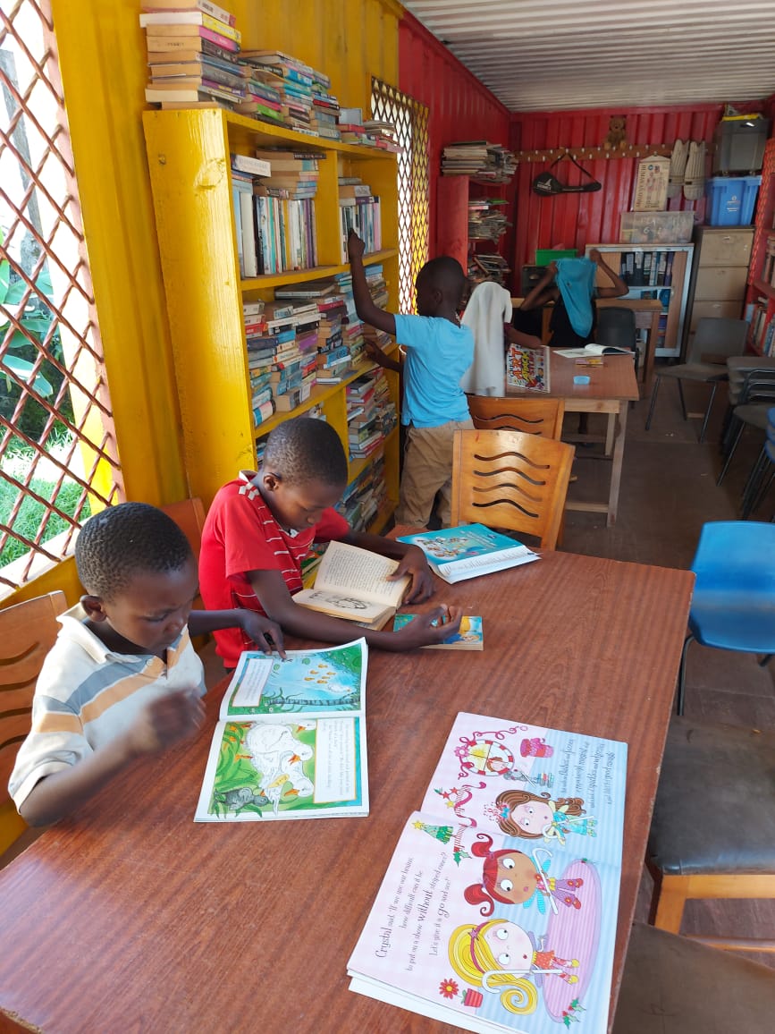 children reading in container library
