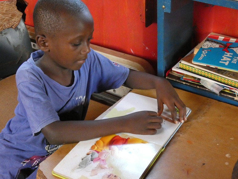 Boy reading in library