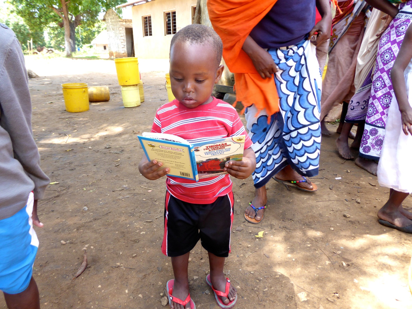 Boy reading outside